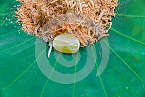 Thai Southern Rice Salad with Herb Vegetables on Lotus leaf with selective focus