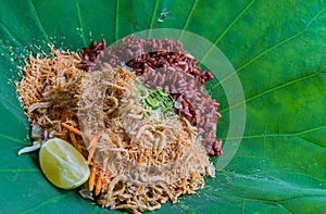 Thai Southern Rice Salad with Herb Vegetables on Lotus leaf with selective focus