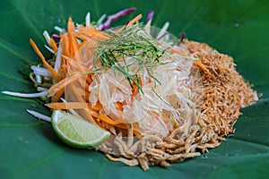 Thai Southern Rice Salad with Herb Vegetables on Lotus leaf with selective focus