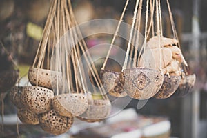 Thai souvenir. A hanging coconut shell by the local Thai people hanging at the shop for display. It can be used as a decoration or