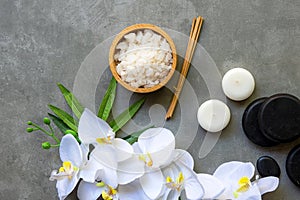 Thai Spa.  Massage spa and hot stones setting for treatment and relax with white orchid on blackboard.  Lifestyle Healthy Concept,