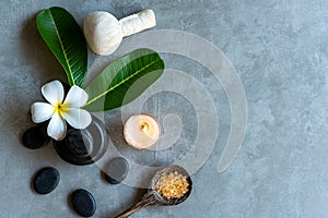 Thai Spa. Top view of white Plumeria flower setting for massage treatment and relax on black blackboard for text banner and copy s