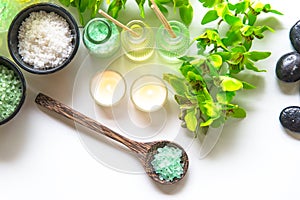 Thai Spa Treatments aroma therapy salt and nature green sugar scrub and rock massage with green orchid flower on wooden white wit