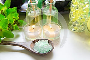 Thai Spa Treatments aroma therapy salt and nature green sugar scrub and stone massage with green orchid flower on wooden white wi