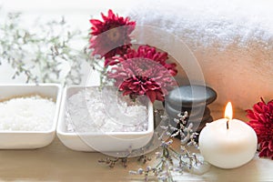 Thai Spa Treatments aroma therapy salt and sugar scrub and rock massage with red flower with candle. Thailand.