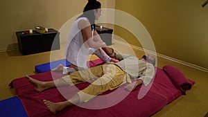 Thai spa woman doing massage for man in spa
