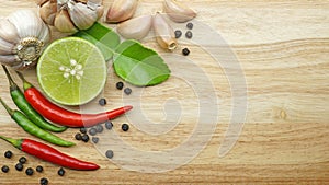 Thai spices ingredients on wooden table, Culinary concept background for recipe menu with copy space, Table top view.