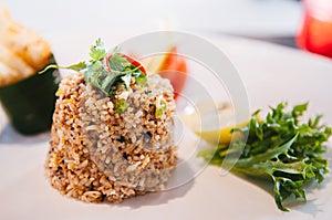 Thai spicy fried rice with vegetable in white plate