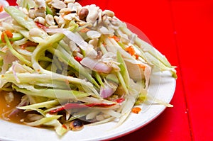 Thai spicy mango papaya salad