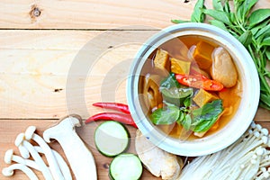 Thai spicy mixed vegetales soup with mushrooms photo