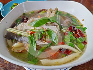 Thai Spicy seafood soup in a white bowl