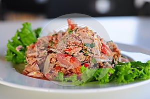 Thai spicy tuna salad with onion and tomato