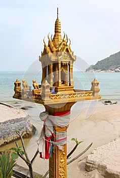 Thai spirit house in front of sea landscape