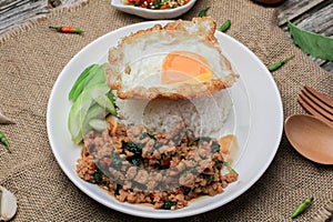 Thai Stir fried  basil with minced pork, chili and fried egg on topped rice.