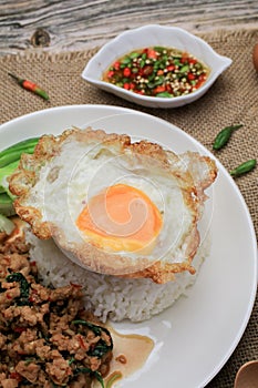 Thai Stir fried  basil with minced pork, chili and fried egg on topped rice.