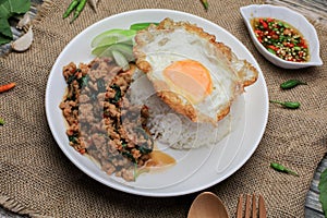 Thai Stir fried  basil with minced pork, chili and fried egg on topped rice.