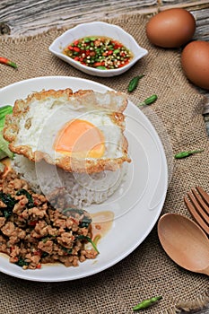 Thai Stir fried  basil with minced pork, chili and fried egg on topped rice.