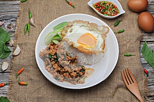 Thai Stir fried  basil with minced pork, chili and fried egg on topped rice.