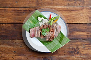 Thai street food Kor moo yang or charcoal grilled pork neck photo