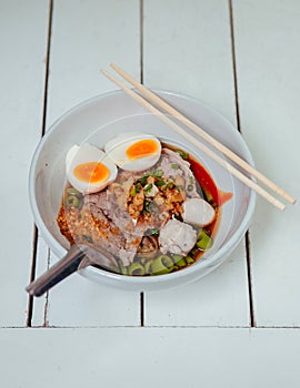 Thai Street food - Thai pork noodle with spicy sauce and boiled eggs