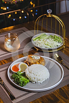 Thai street food, traditinal Thai omlete stuff minced pork for lunch time on wooden table background