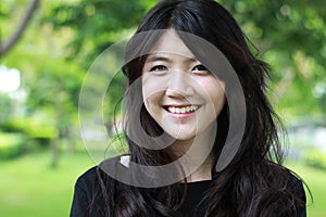 Thai student teen beautiful girl Black Dresses relax and smile.