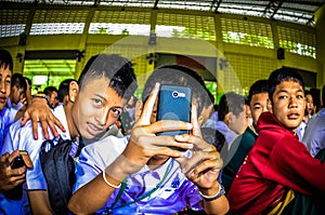 Thai Student Use Mobile Phone Take a photo.