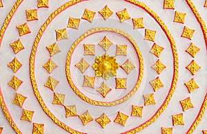 Thai Style art golden pattern on a wall in public temple