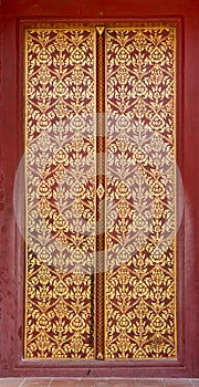 Thai style art painting on door of the temple