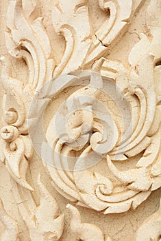 Thai style decorative pattern molding on temple wall