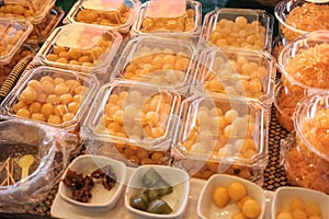 Thai style desserts in plastic boxes