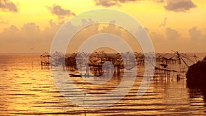 Thai style fishing trap in Pak Pra Village at sunrise.