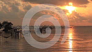 Thai style fishing trap in Pak Pra Village at sunrise