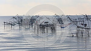 Thai style fishing trap in Pak Pra Village at sunrise