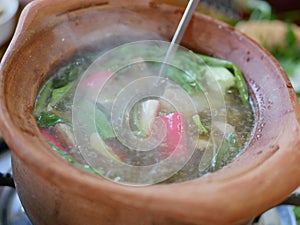 Thai style hot pot Moo Joom in a clay pot