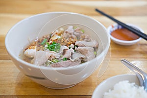 Thai style noodle with pork entrails and vegetables photo