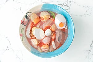 Thai-style noodle soup with fishballs and homemade red sauce