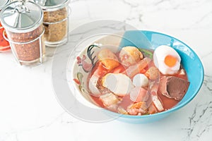 Thai-style noodle soup with fishballs and homemade red sauce