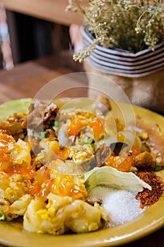 Thai style noodle on wooden table and dry flower