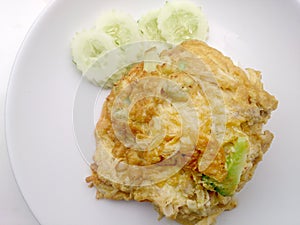 Thai-Style Omelet (Khai Jiao), Omelet with vegetables in white plate, It's popular traditional Thai style food