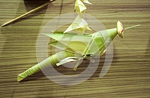 Thai style palm leaf grasshopper mobile handicraft