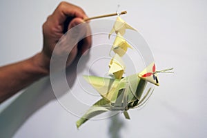 Thai style palm leaf grasshopper mobile handicraft