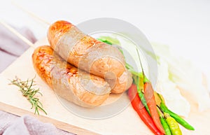 Thai style sausage, made from glass noodles, lean pork with garlic, pepper, coriander seed, seasoning sauce, grilled. placed on a