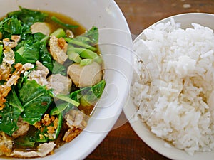 Thai style vegetable stew pork soup with steamed rice Gaw Lao Kao Plaw