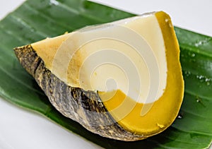 Thai sweets - Egg custard in pumpkin on banana leaf  : Pumpkin custard, delicious Thai desserts