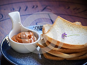 Thai Tea custard eat with crispy bread.