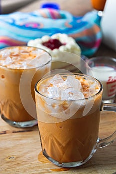 Thai tea milkshank sweet drink on the glass for refreshment