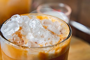 Thai tea milkshank sweet drink on the glass for refreshment