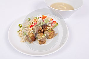 Thai tempeh with coriander and rice on a white