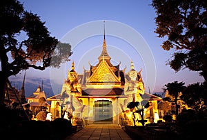 Thai temple glowing in golden light during sunset